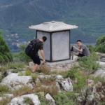 Researchers are taking pictures of a small building